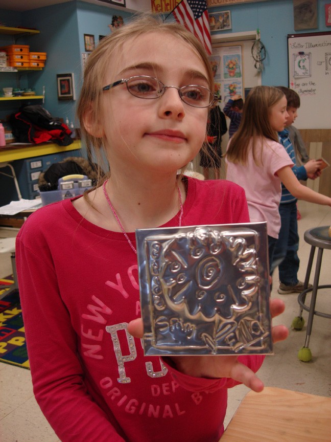 11Second grade girl with her tin 72